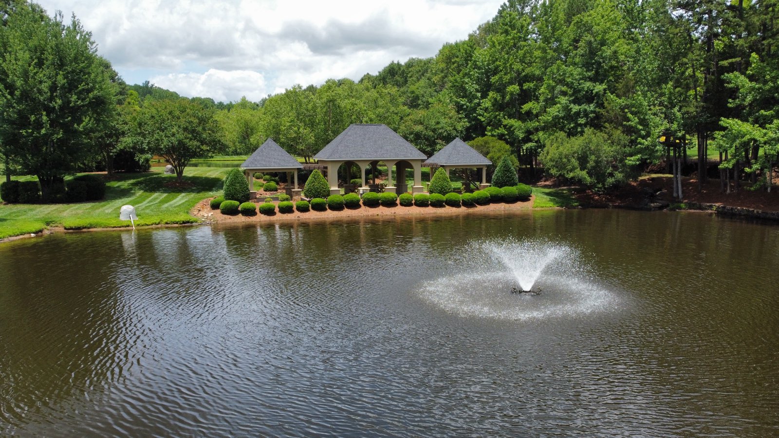 Lakeside pavilion overlooking the community pond and fountain