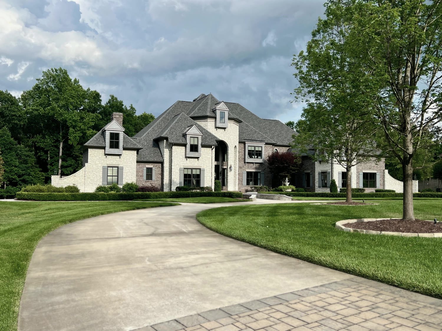 Stately custom stone home with manicured gardens in Pine Creek