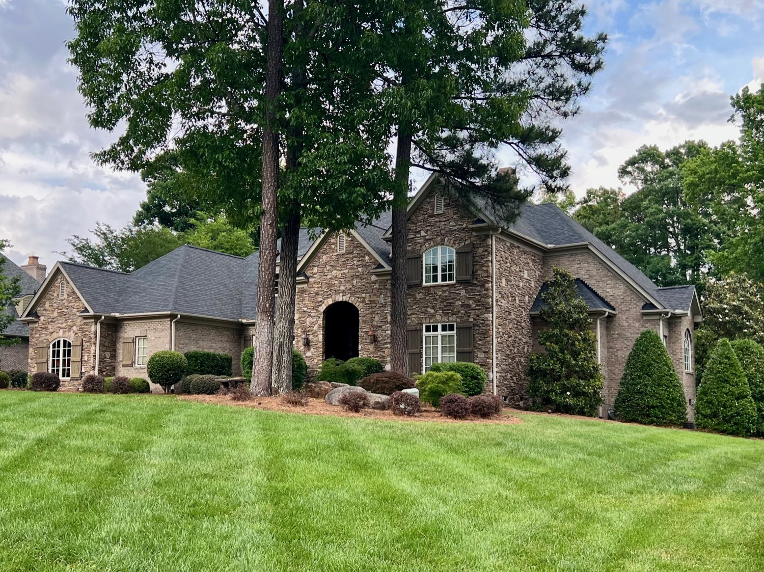 French country home with stone accents